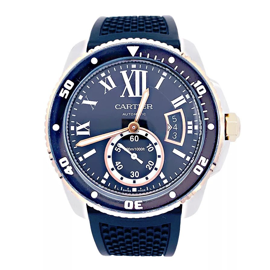 Montre Cartier Calibre en or et acier sur bracelet caoutchouc.