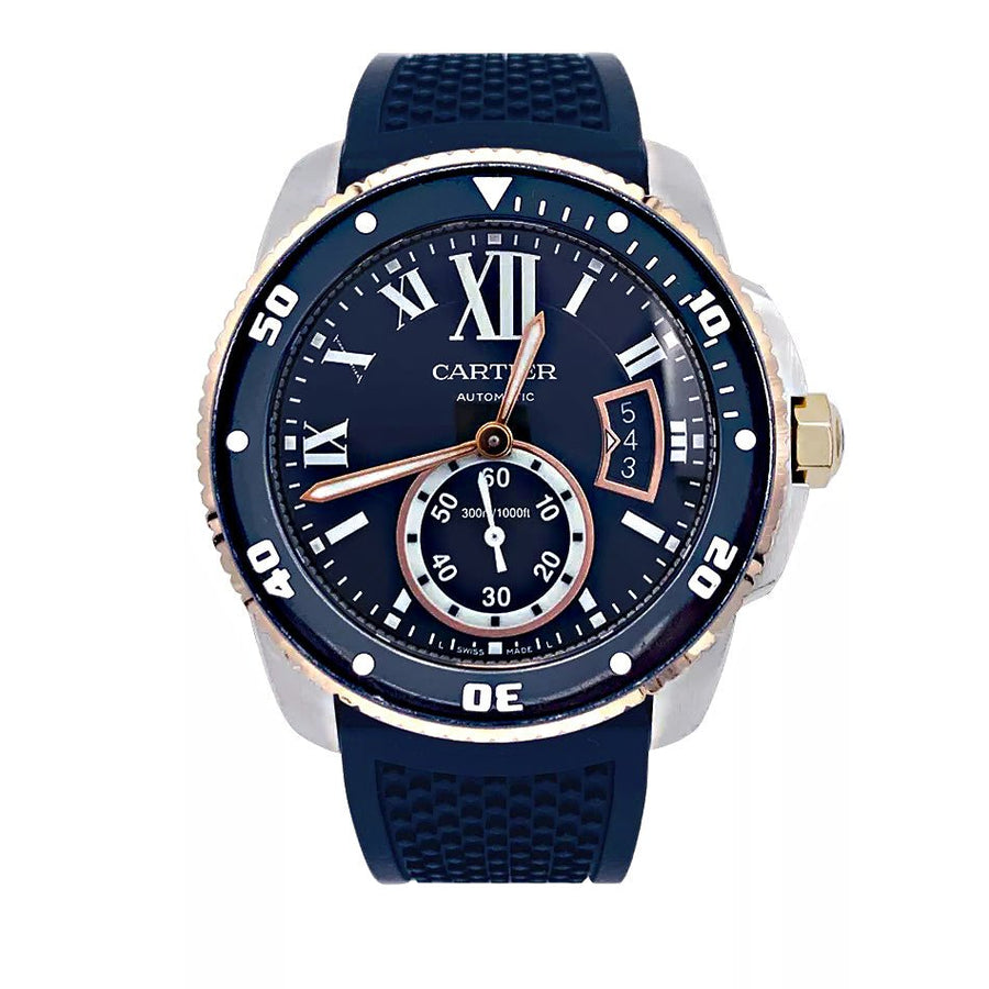 Montre Cartier Calibre en or et acier sur bracelet caoutchouc.