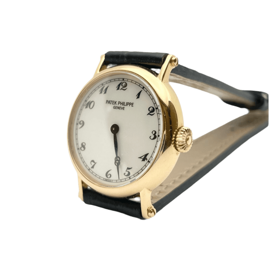 Montre PATEK PHILIPPE en or rose, cuir et porcelaine