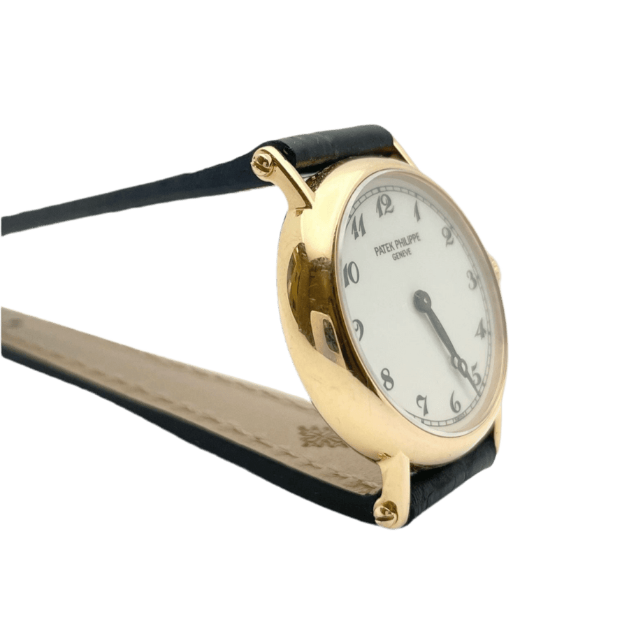 Montre PATEK PHILIPPE en or rose, cuir et porcelaine